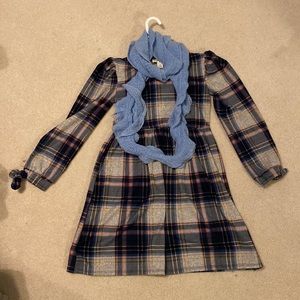 A beautiful striped dress with a scarf to hang around your neck.